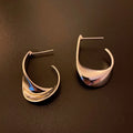 Geometric twisted metal earrings in gold or silver electroplated finish