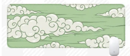 Large rectangular cloud pattern desk mat made of natural rubber on a wooden desk.