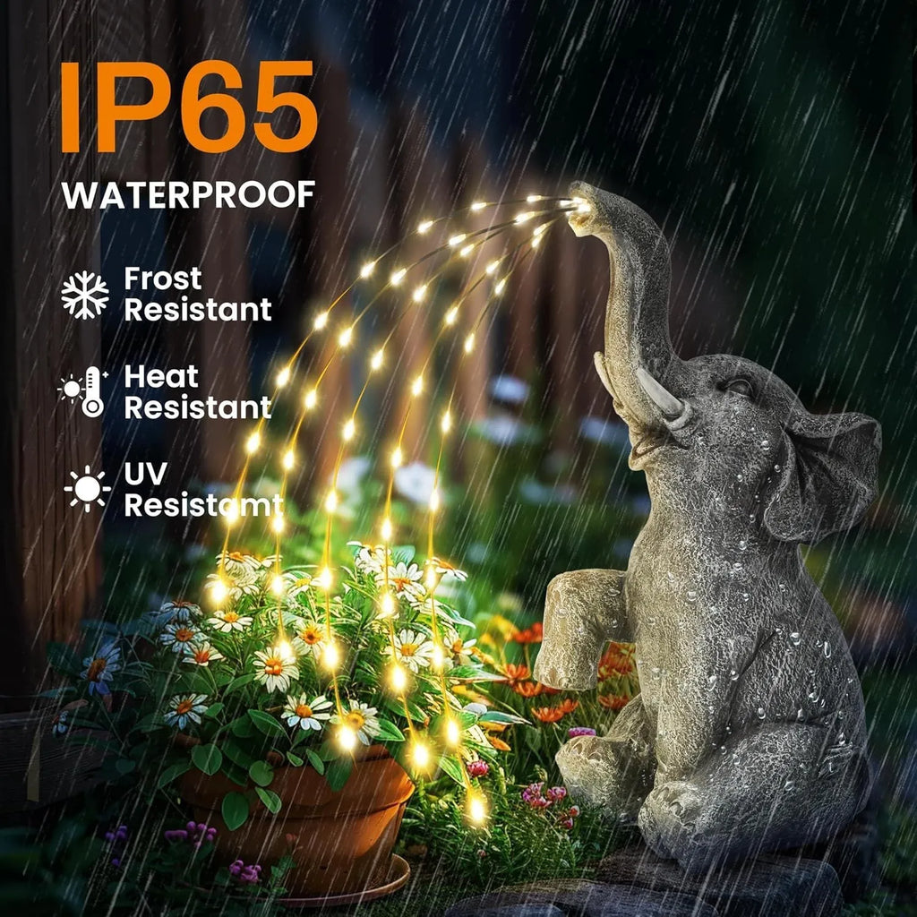 Outdoor resin elephant garden statue with integrated LED light strip.