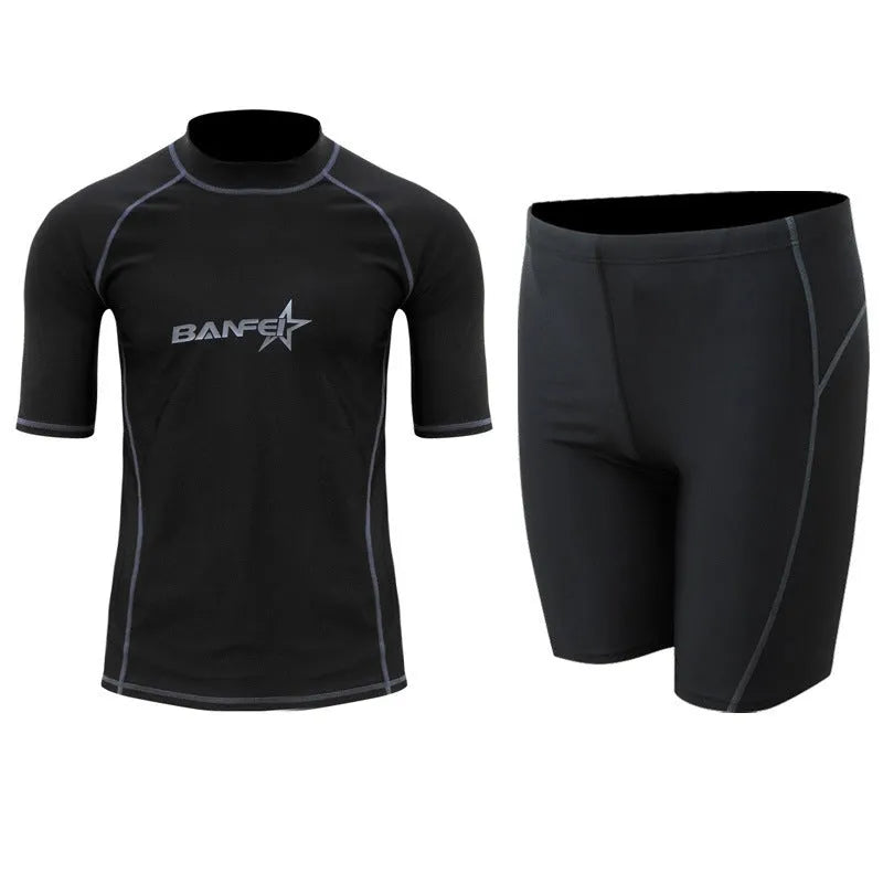 Men's navy blue quick-drying nylon swimsuit set with half-sleeve top and pants for swimming and surfing.