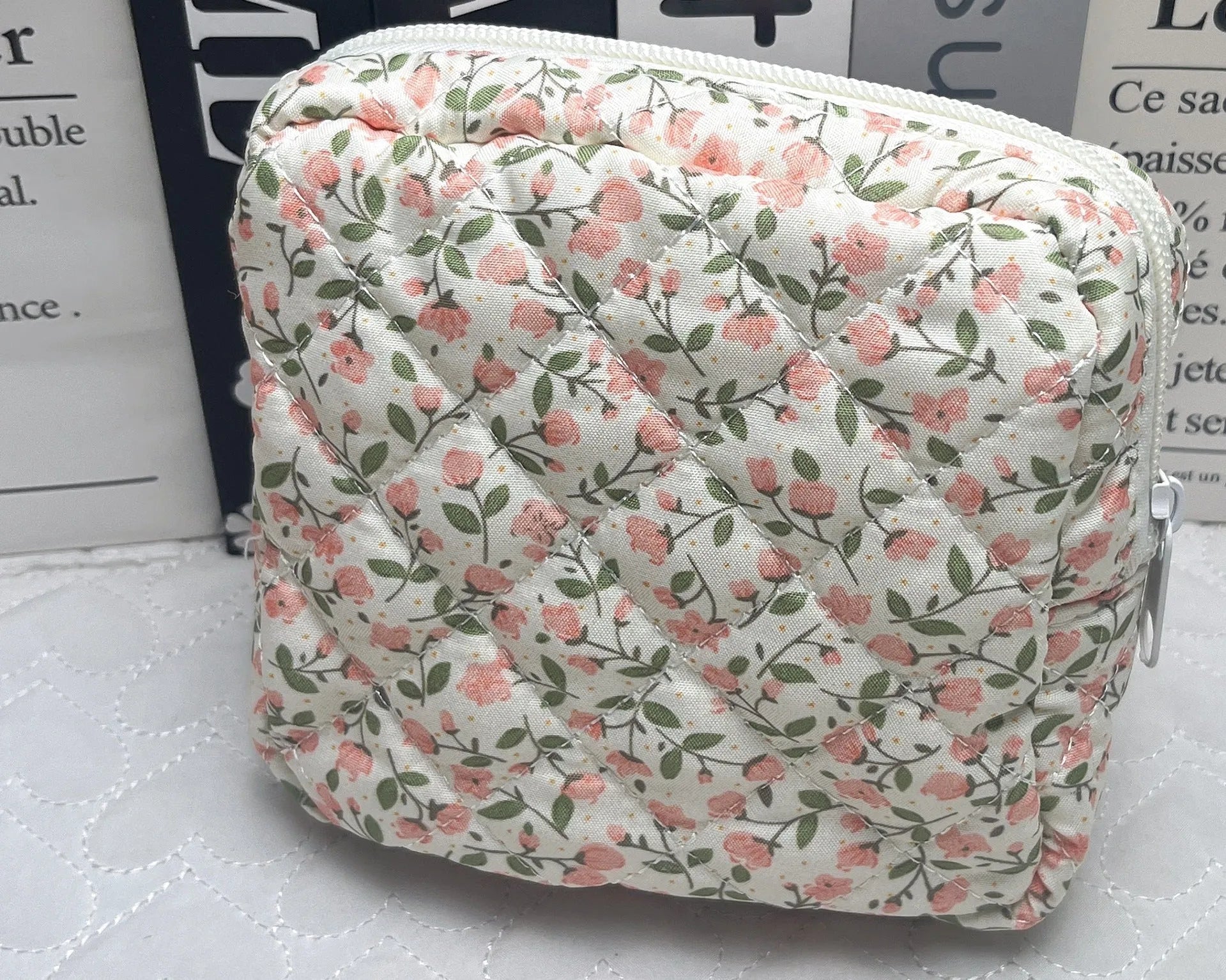 Floral polyester key storage bag with sewing thread detailing in multiple colour patterns