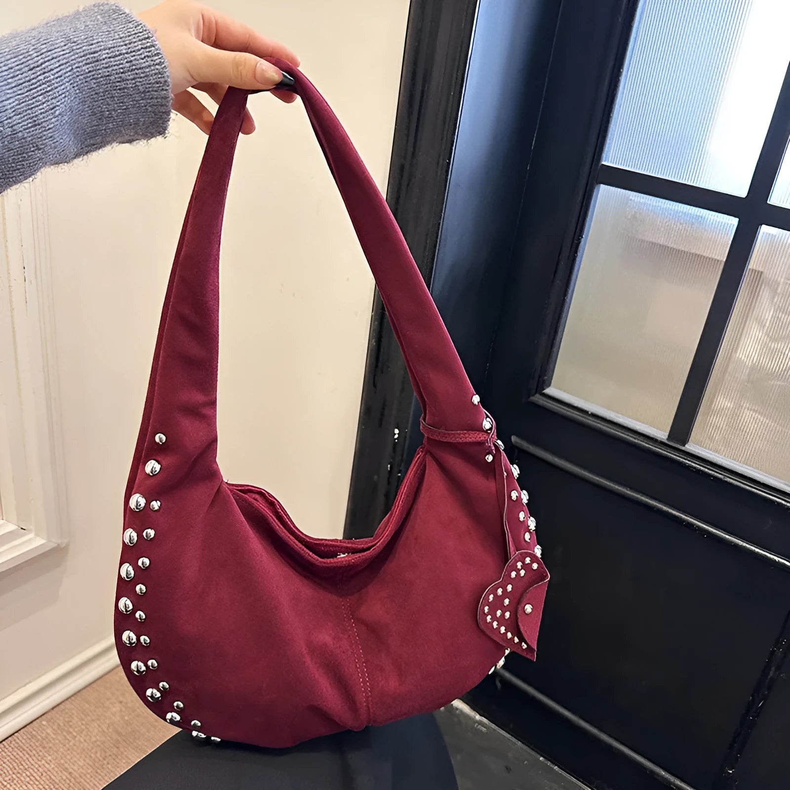 A soft plush underarm tote handbag in a retro style, shown in a colour option.