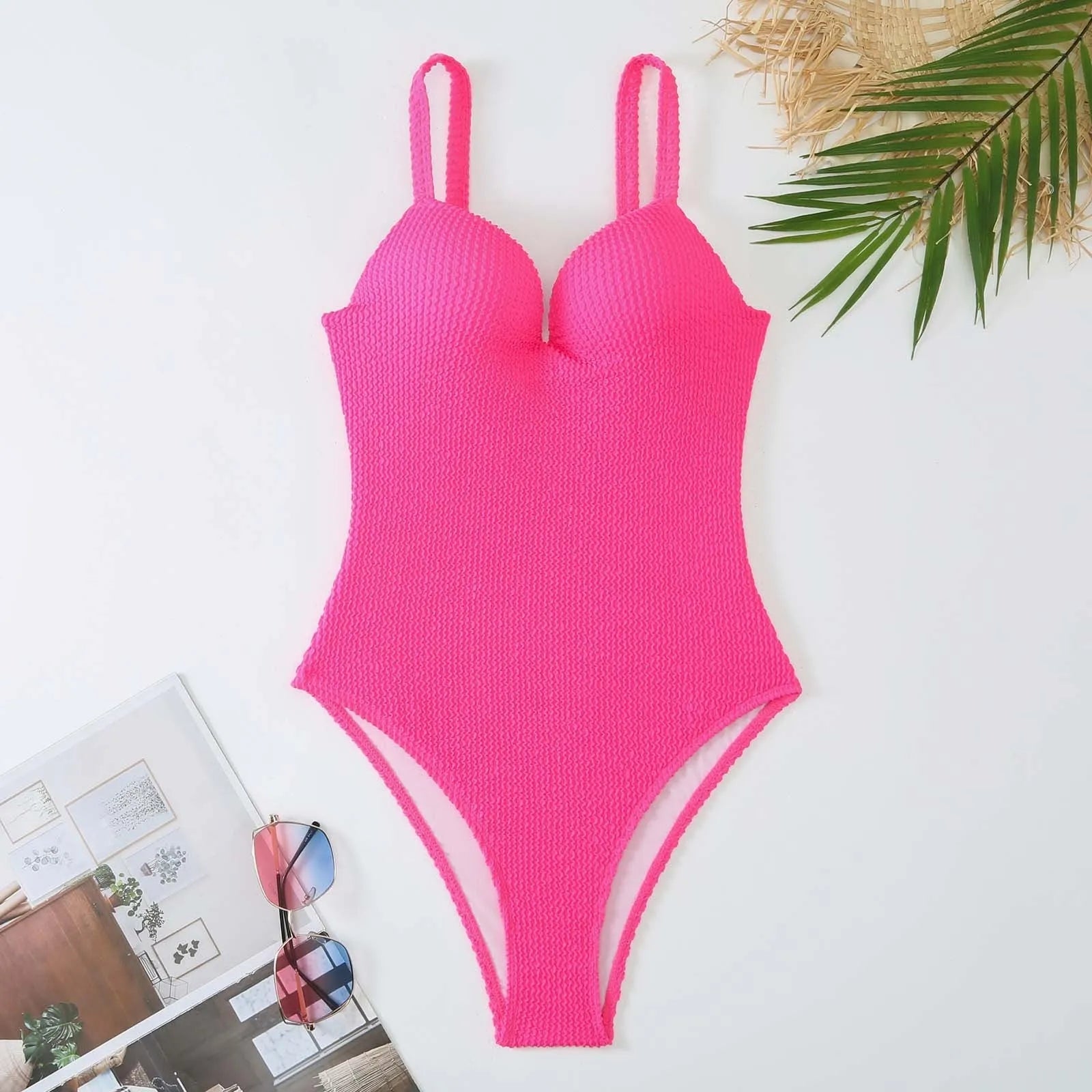 Women's one-piece swimsuit with sunken stripe pattern in polyester fabric, shown in multiple colour options