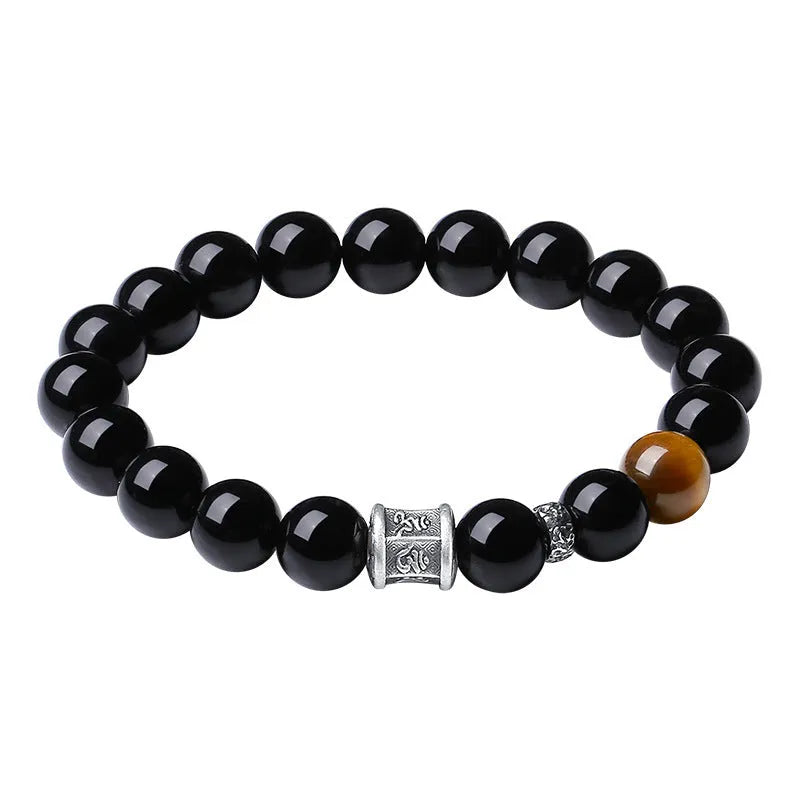 Men's obsidian and pure silver bracelet with a 10mm mantra prayer wheel bead.