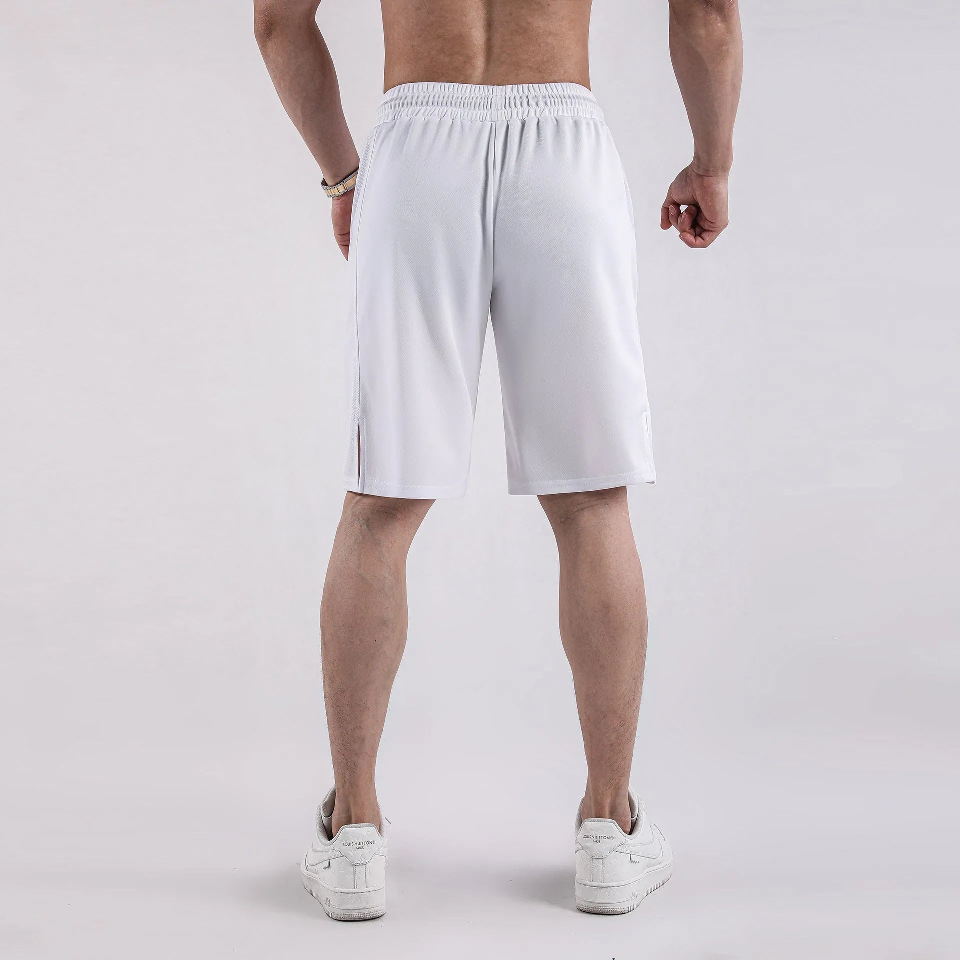 Men's black quick-drying mesh shorts with loose capri pants fit and mid-waist design