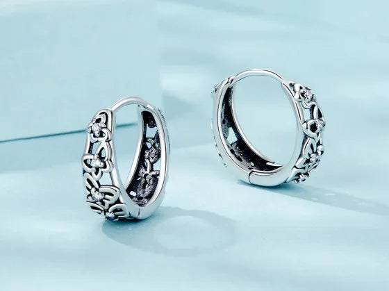 Sterling silver butterfly earrings with hollow design and zircon stone accents