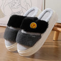 Pink and green thermal cotton slippers with plush upper and non-slip sole.