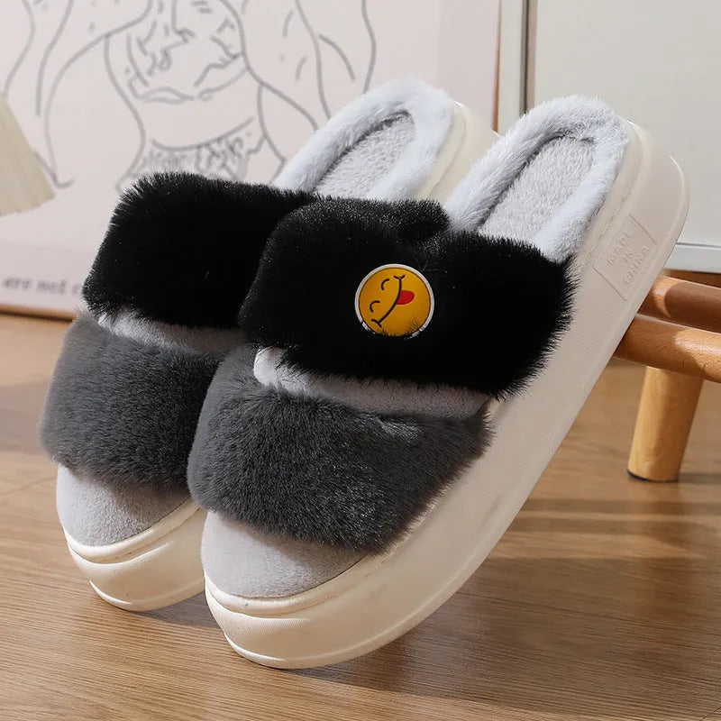 Pink and green thermal cotton slippers with plush upper and non-slip sole.