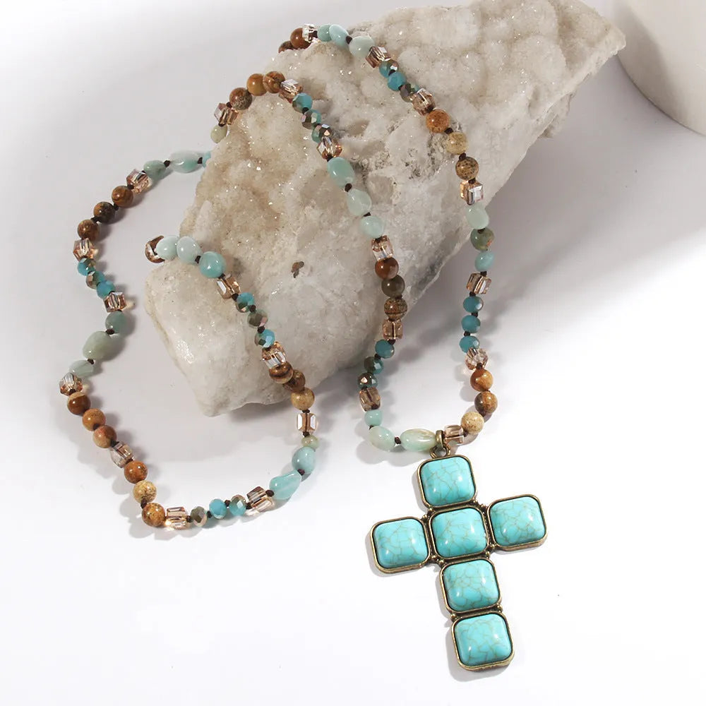 Glass and stone square cross pendant necklace with knotted chain in blue, 81cm long