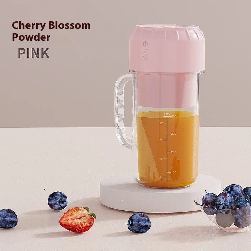 Portable USB-powered juicer in avocado green or cherry blossom pink with 150W motor and multiple blade options.