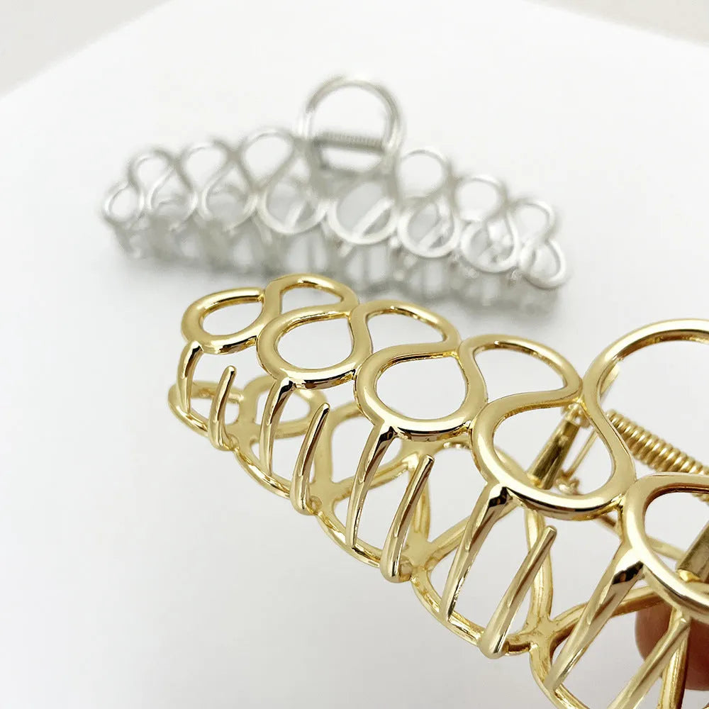 Large minimalist updo hair clip in gold or silver electroplated alloy with tassel details
