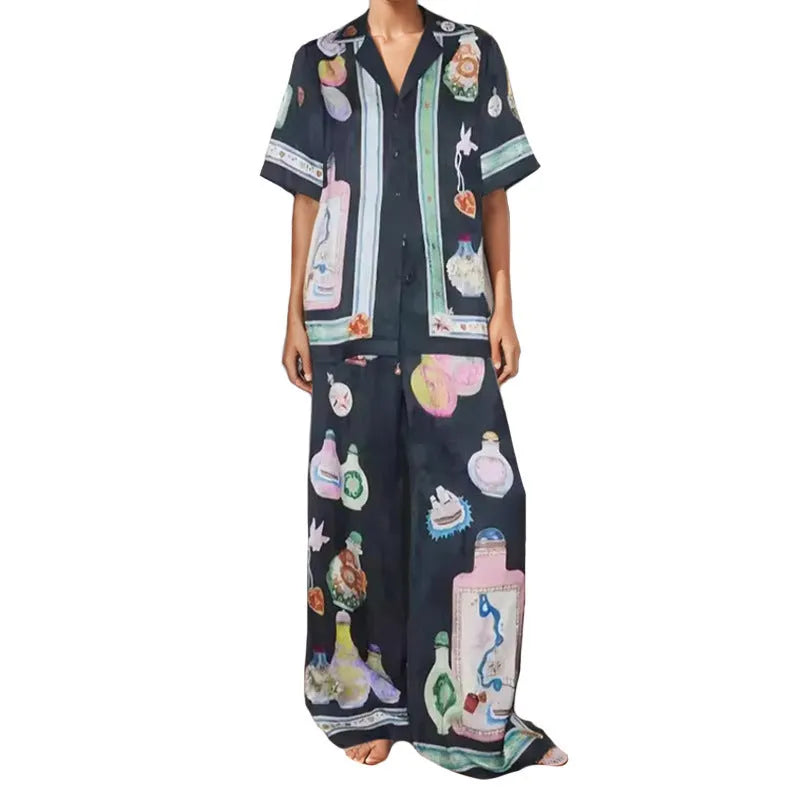 Women's black casual set with cartoon print, featuring a long-sleeve cardigan and matching trousers