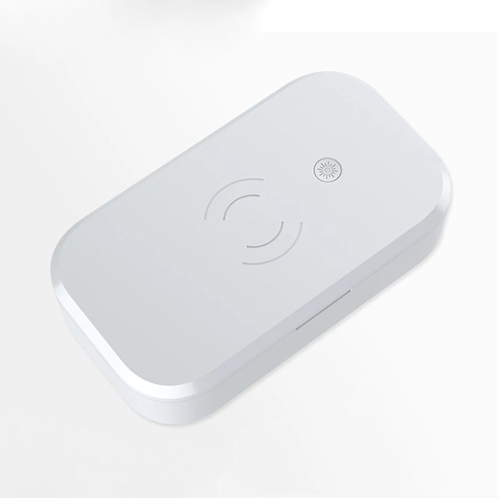 White ultraviolet disinfection box with wireless phone charging top and USB cable.