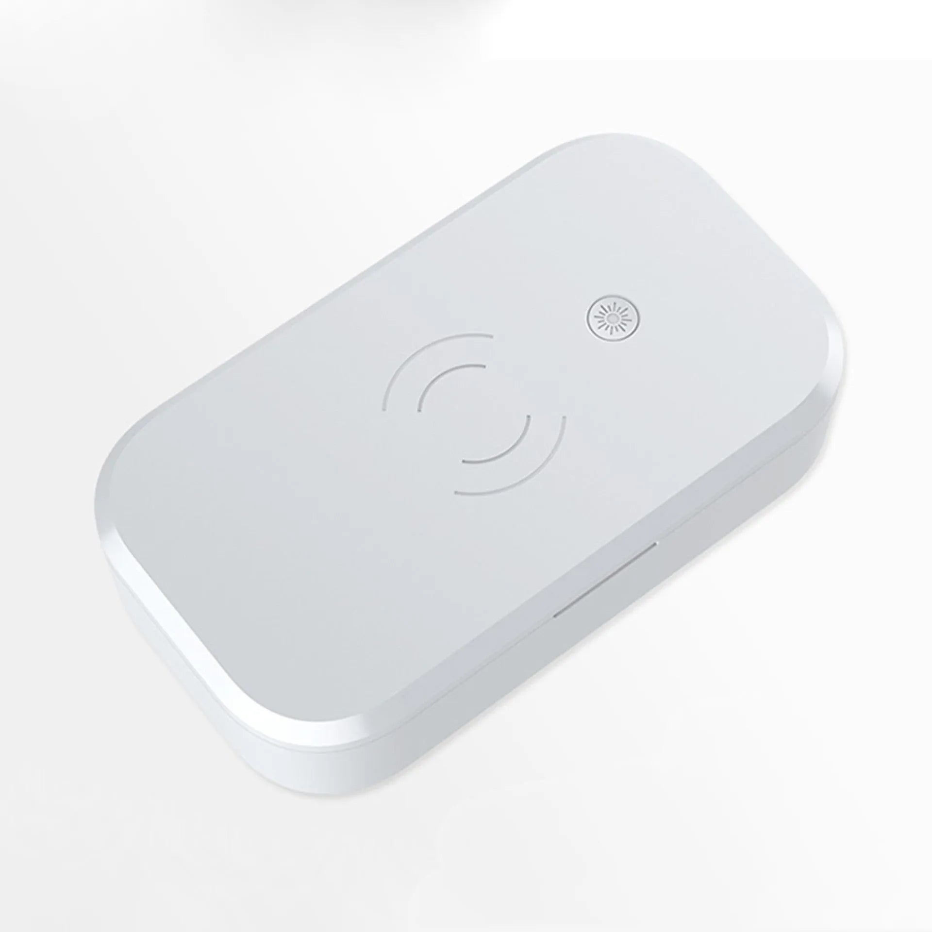 White ultraviolet disinfection box with wireless phone charging top and USB cable.
