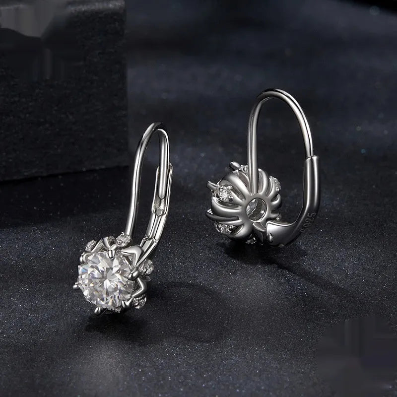 Sterling silver flower bud ear clip with white gold plating and 0.5 carat moissanite stone