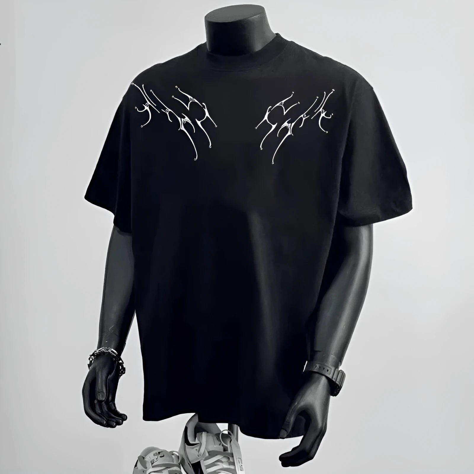 Men's black loose fit pure cotton short sleeve t-shirt with a print, laid flat.