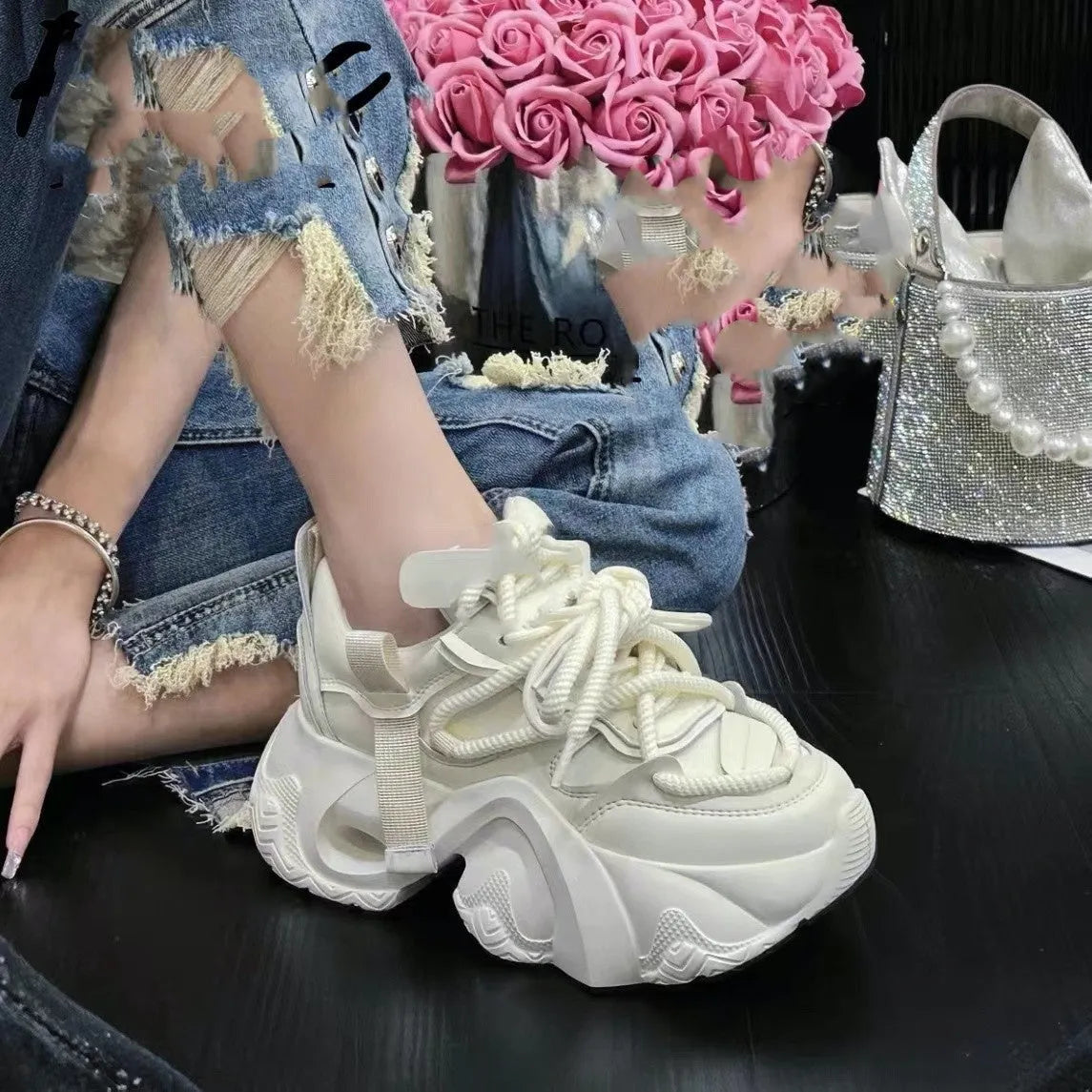 Women's creamy white casual sneakers with cross straps and a wedge heel on a white background