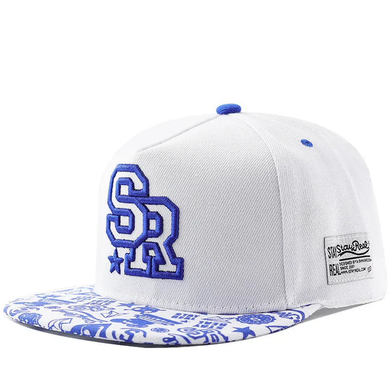 Cotton baseball cap with letter embroidery in black or white colours, showing adjustable strap and dome crown