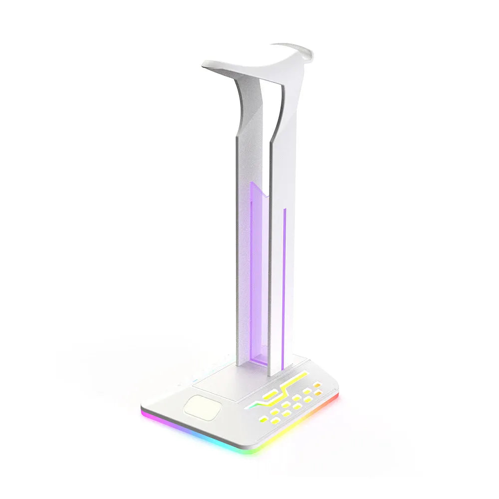 RGB colour-changing headphone display bracket with integrated dual USB ports on a desk.