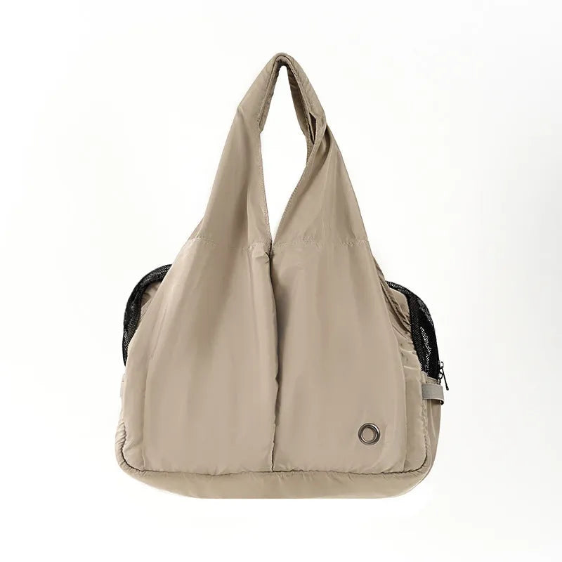 Apricot cloth pet carrier handbag showing portable design for pet transport