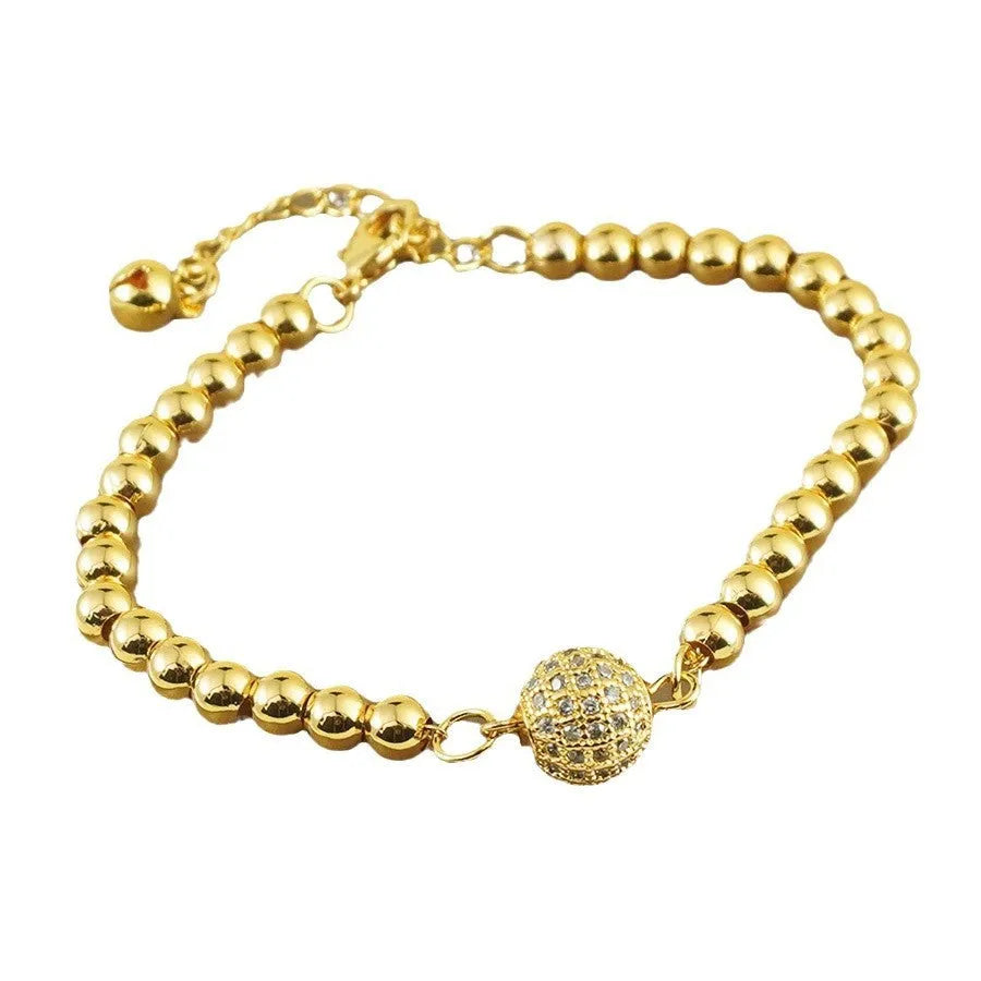 Copper bracelet with heart shape design, zircon accents and Arabic style patterning