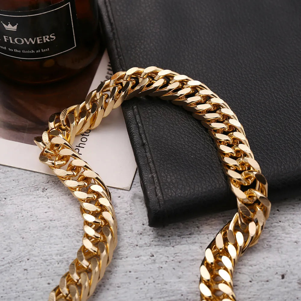 Gold-toned women's thick chain necklace with red accents, showing chunky 6cm wide links on a 32cm chain.