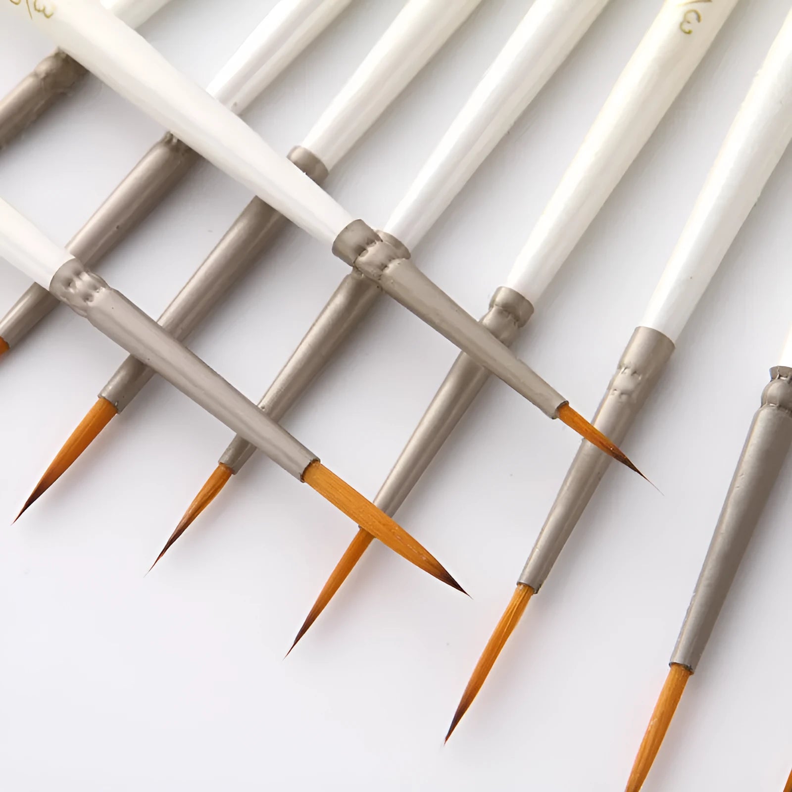 Set of twelve fluorescent marker artist brushes in assorted sizes, stored upright in a solid wood pen holder.