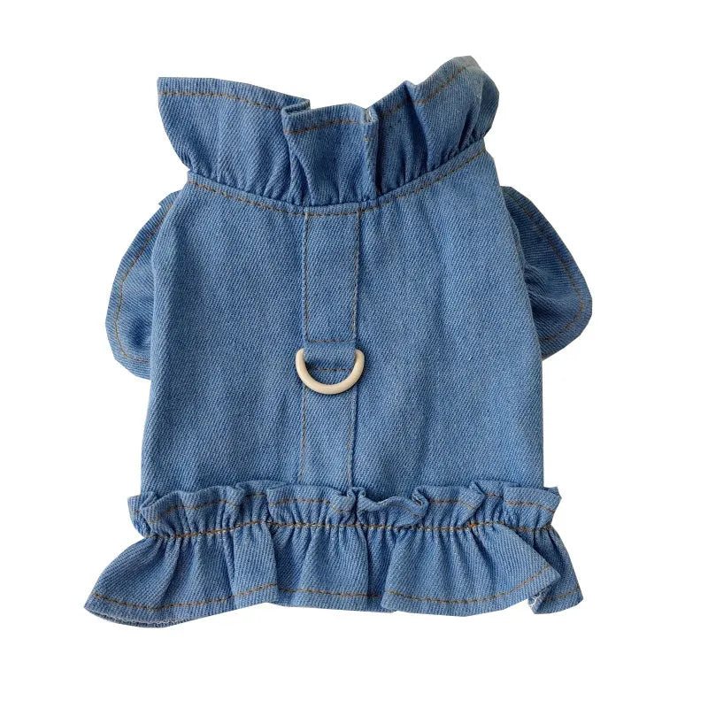 Blue denim dog dress vest with ruffles and a metal leash hook on the back for small dogs.