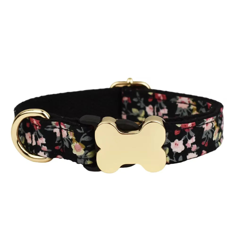 Flat nylon dog collar with a printed grid pattern and a central bone-shaped metal buckle.