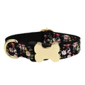 Flat nylon dog collar with a printed grid pattern and a central bone-shaped metal buckle.