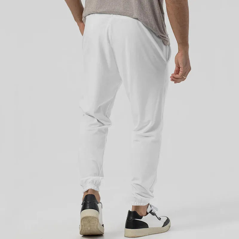 Men's casual track sweatpants in loose tapered straight-leg design showing army green colour option