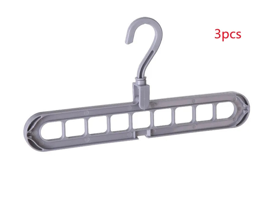 Plastic clothes hanger with rotating hook in assorted colours on white background