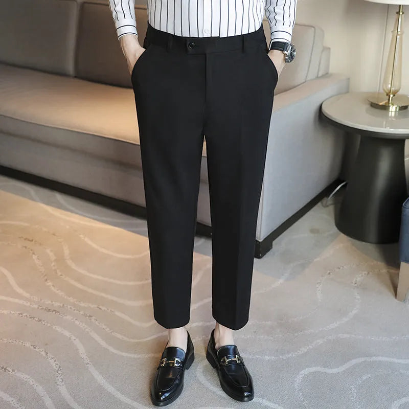 Men's straight leg brown corduroy trousers with an elasticated waistband on a hanger
