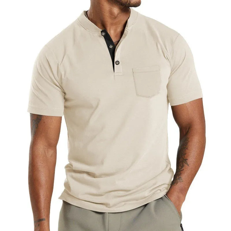 Plus size man wearing a light grey short sleeve casual shirt with a button chest pocket.