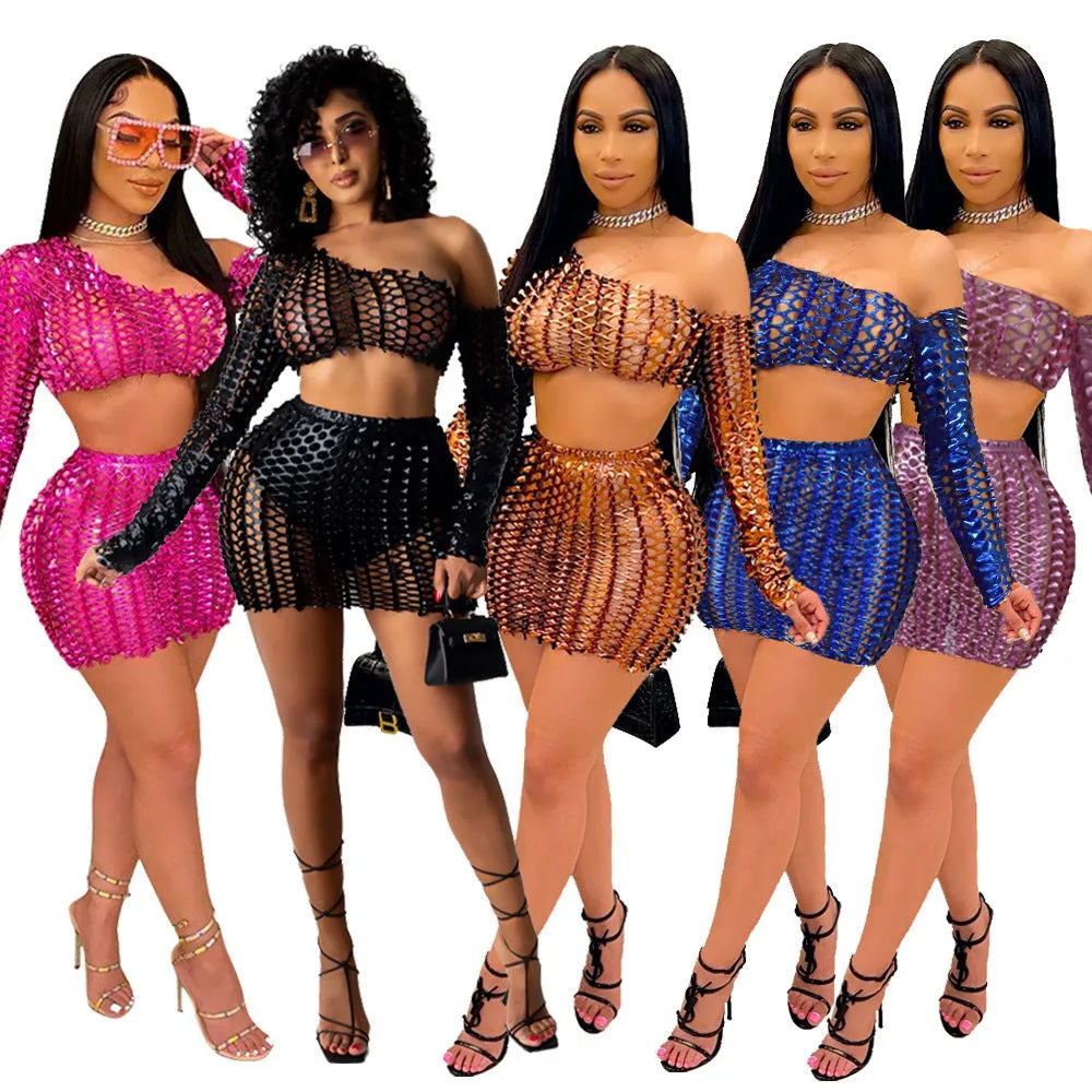 Women's black two-piece dress set with sleeveless top, short skirt, and hollow-out net detailing.
