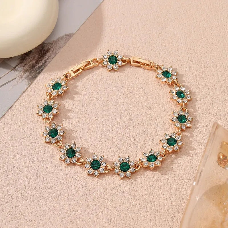 Floral-shaped zinc alloy bracelet with electroplated finish in gold and silver colour options.