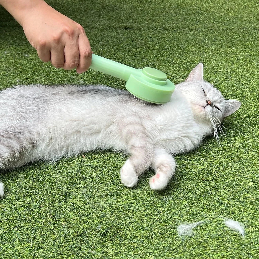 Green and yellow pet grooming brush with stainless steel bristles for cats and dogs