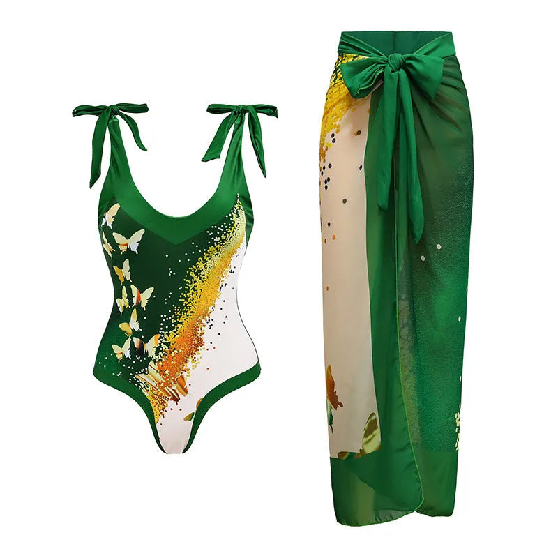 Women's solid colour one-piece swimsuit with spaghetti straps and a matching skirt.