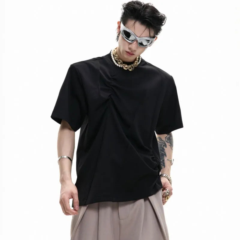 Men's grey cotton T-shirt with pleated detail on the front, showing a loose fit and round neck.