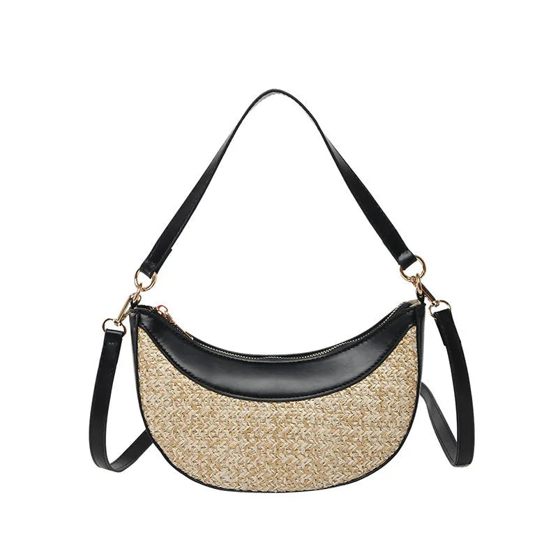 Hard woven straw dumpling-shaped crossbody shoulder bag with organised interior compartments.