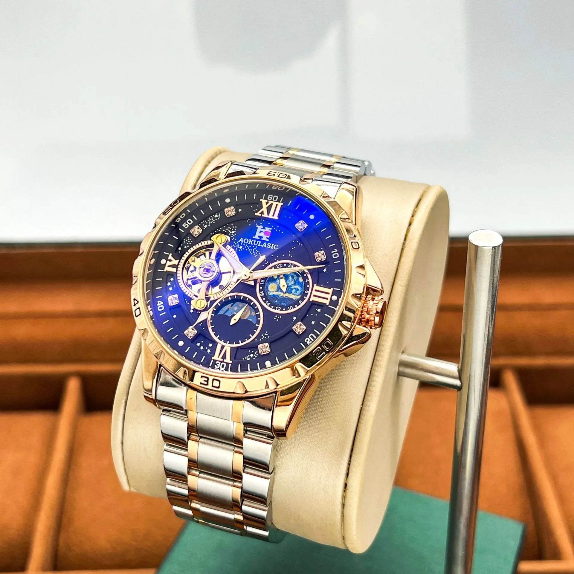 Men's automatic mechanical watch with rose gold case and black dial showing large display