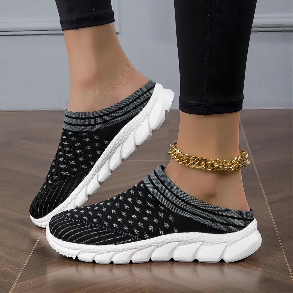 Women's black Flyknit semi slippers with hollowed-out sewing line detail and viscose sole