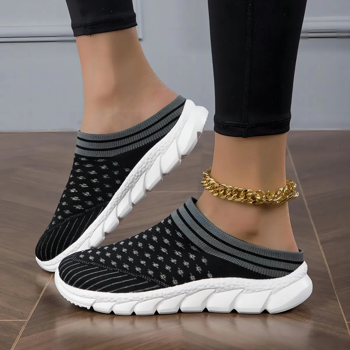 Women's black Flyknit semi slippers with hollowed-out sewing line detail and viscose sole