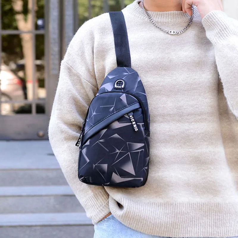 Men's Oxford cloth crossbody chest bag with earphone hole, showing zipper closure and vertical messenger style