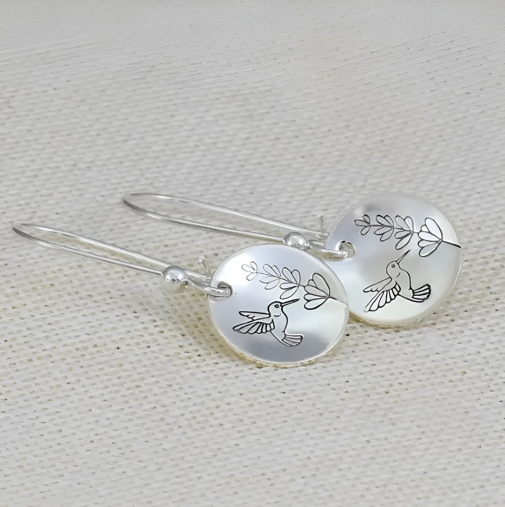 Silver women's earrings with bird and flower motifs on glossy round zinc alloy design