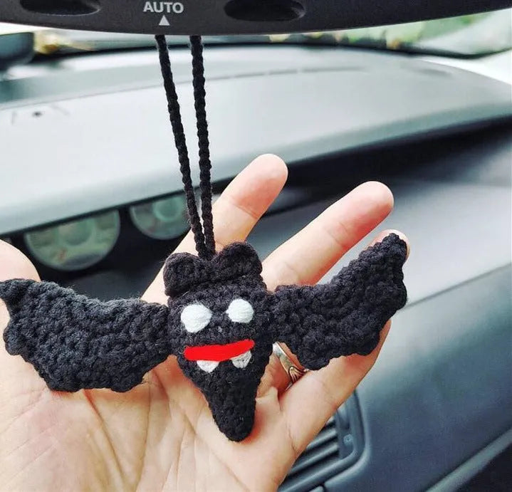 Plush hand-woven car hanging ornament in a cartoon design made from polyester