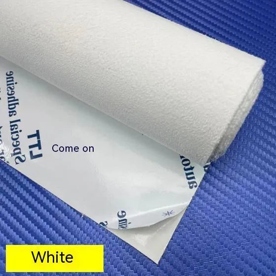 Sheet of self-adhesive elastic suede in beige colour, showing its thickness and adhesive backing.