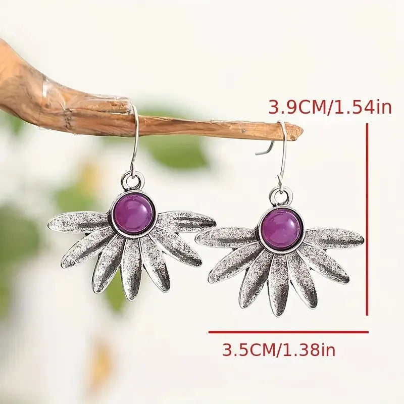 Purple bohemian style earrings with resin gemstone accents and animal zodiac modelling