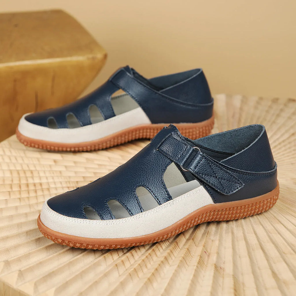 Women's plus size flat sandals with hollow-out toe cap in red, white, or blue on a thick rubber sole.