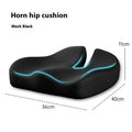 Dark grey memory foam office chair cushion for waist support, shown on a desk chair.